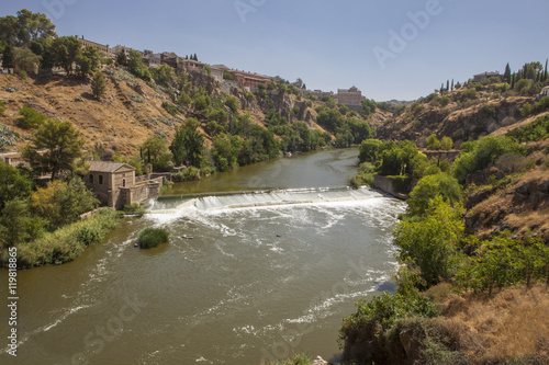 Tagus river with ancient mill dam crossing Toledo City, Spain