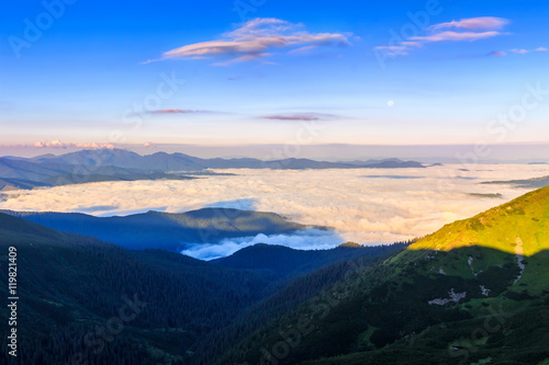 Picturesque sunrise morning in mountains above clouds, Carpathians, Ukraine. © O.Farion