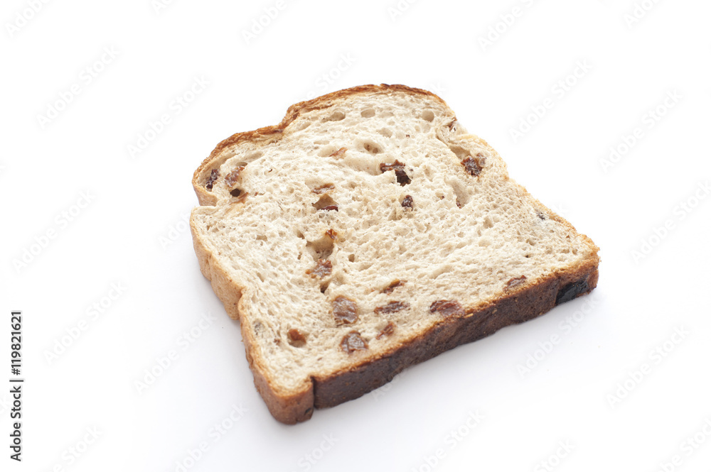 One slice of fruit bread on white background One slice of fruit bread on white background