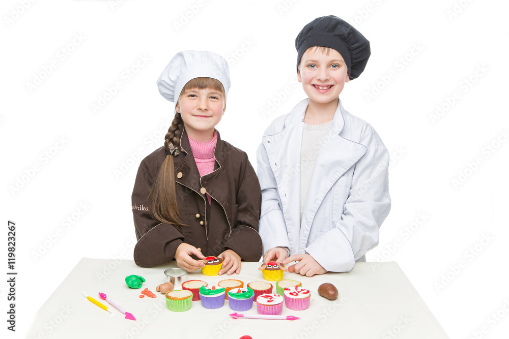 Children making christmas cupcakes Children making christmas cupcakes