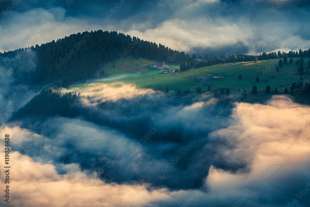 Foggy summer scene in the Dolomite Alps.