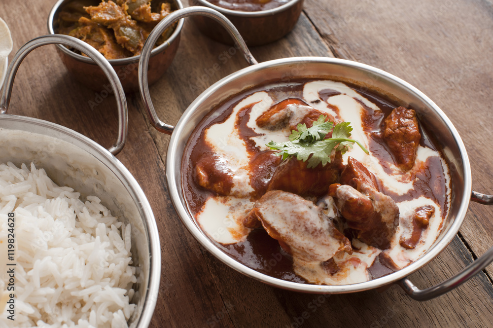 Creamy sauce on cooked chicken with rice on table Creamy sauce on cooked chicken with rice on table