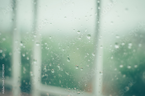 a lonely teddy bear is thinking about something in the rainy season