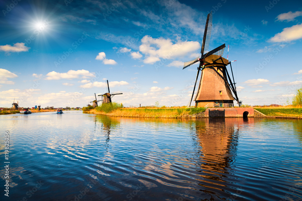 Summer scene in the famous Kinderdijk canal with windmills