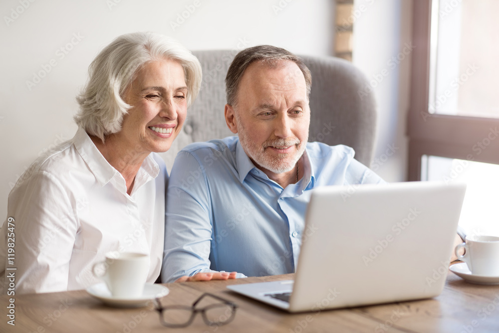 Positive couple sitting at the table Positive couple sitting at the table