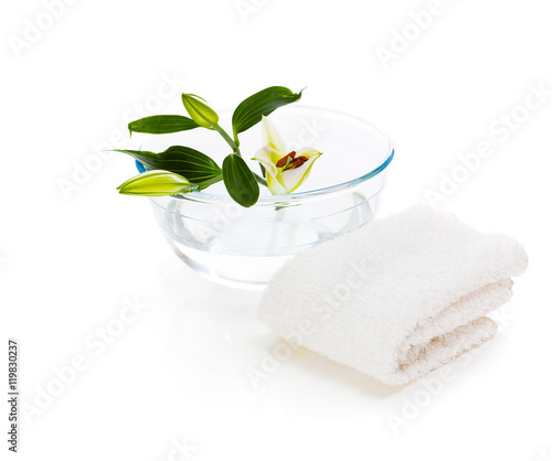 spa setting with lily isolated on white background