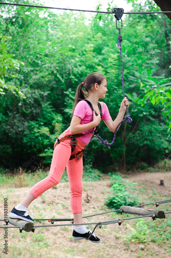 adventure climbing high wire park - hiking in the rope park girl adventure climbing high wire park - hiking in the rope park girl
