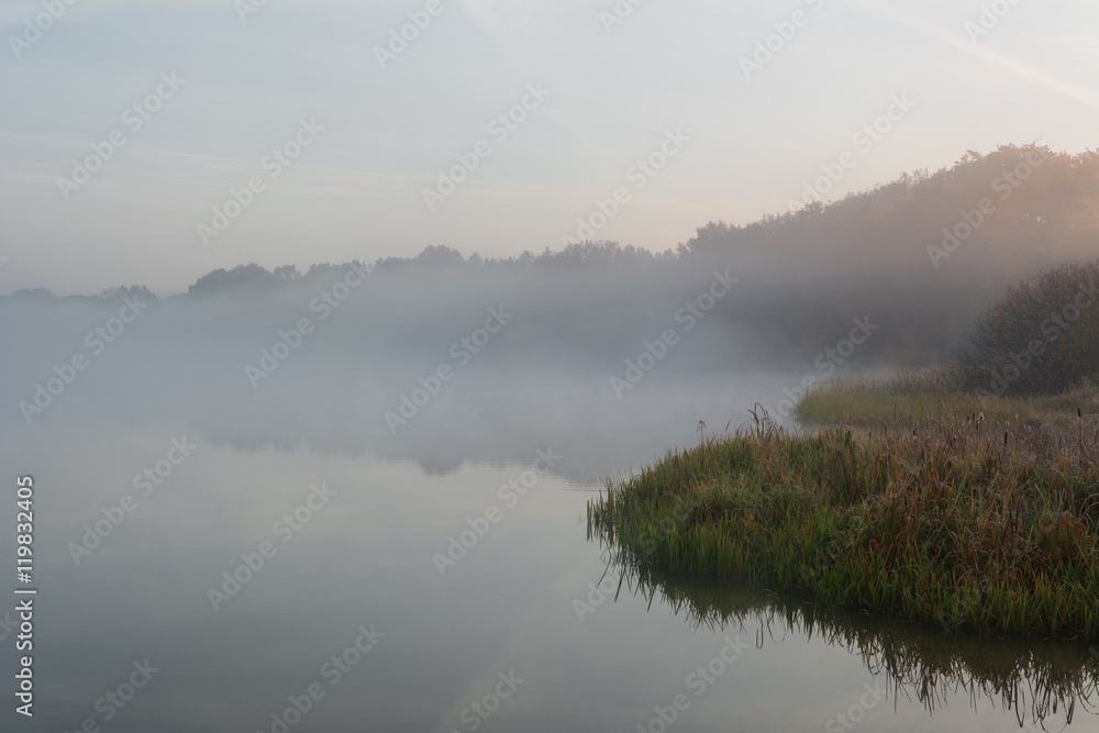 Misty morning by the lake. Poland.