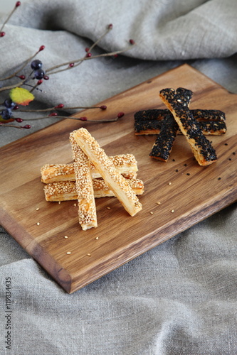Cheese & Sesame Pie Sticks on Wooden Board