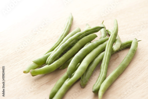 green beans on wooden table