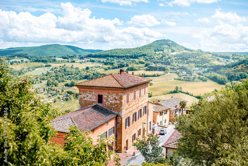 Beautiful landscape view on the meadow with old buildings in Montepulciano town in Italy