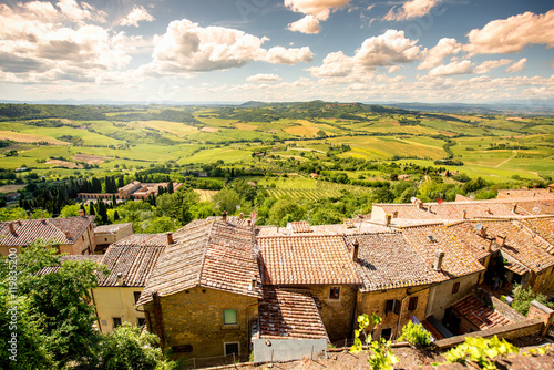 Beautiful landscape view on the meadow with old buildings in Montepulciano town in Italy photo