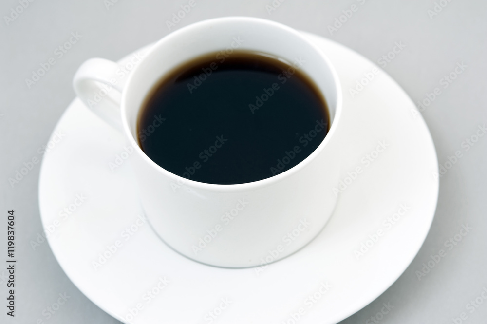 Cup of black coffee on saucer Cup of black coffee on saucer