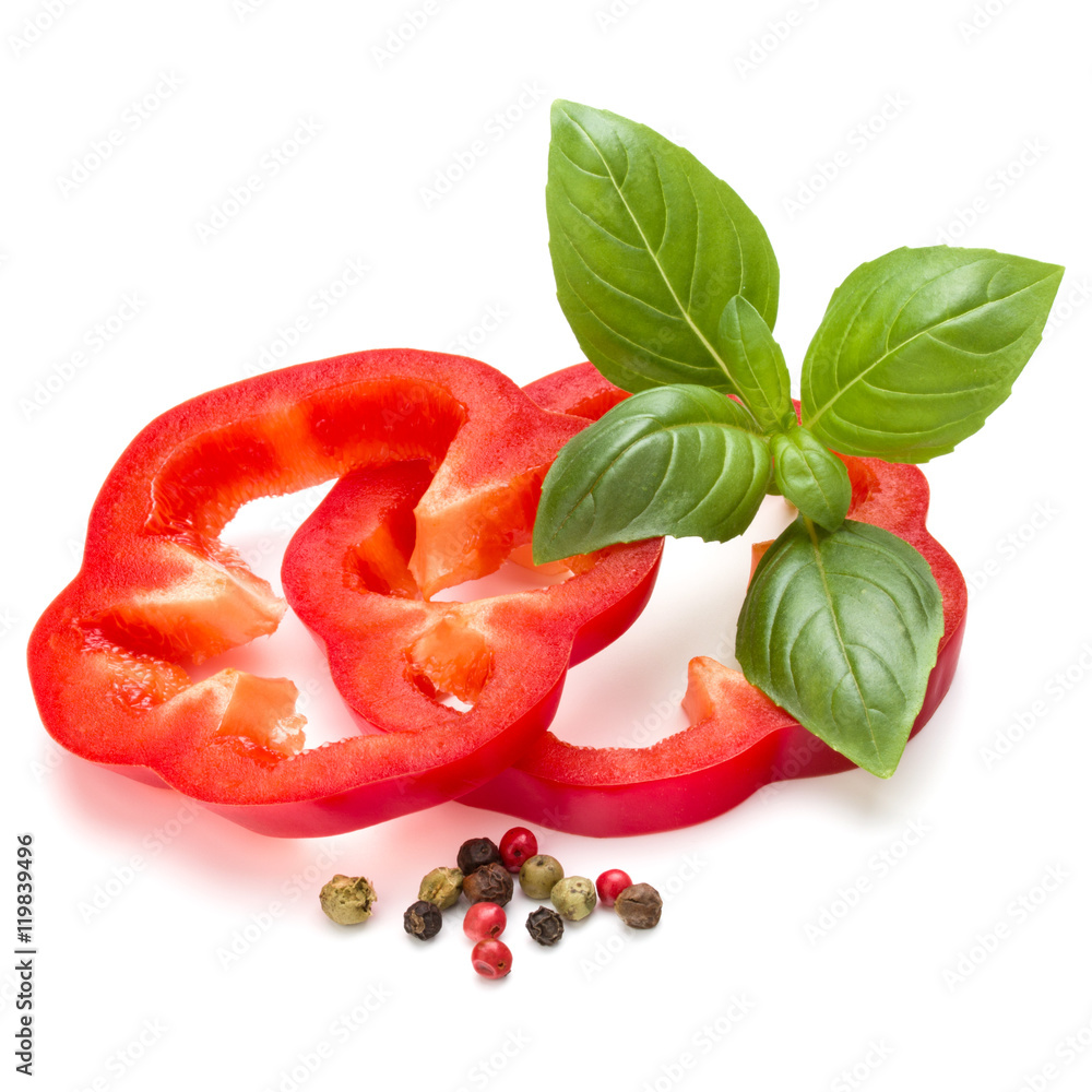 Red sweet bell pepper slices and basil leaves isolated on white Red sweet bell pepper slices and basil leaves isolated on white