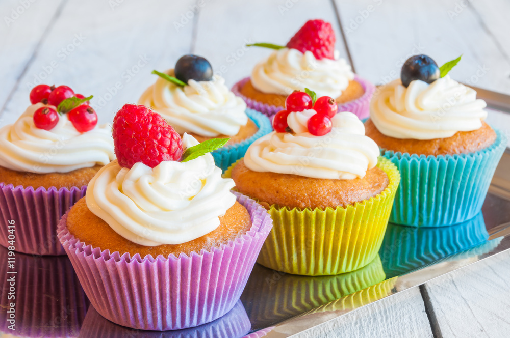 Colorful cupcakes with fresh berries