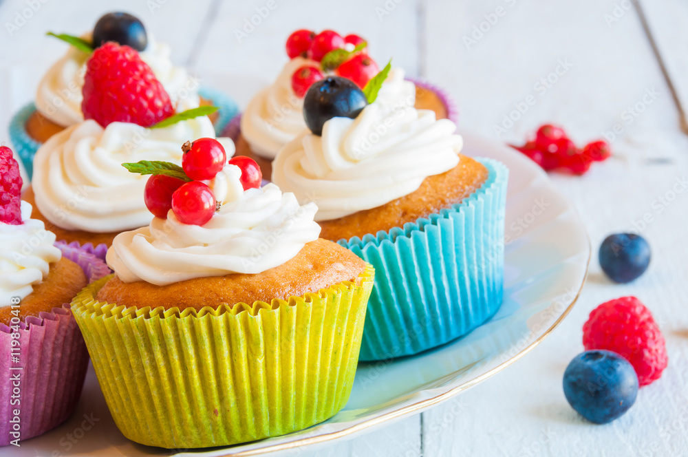 Colorful cupcakes with fresh berries