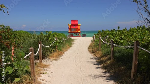 Miami Beach in South Beach with new lifeguard tower and coastline with colorful cloud and blue sky. Florida.