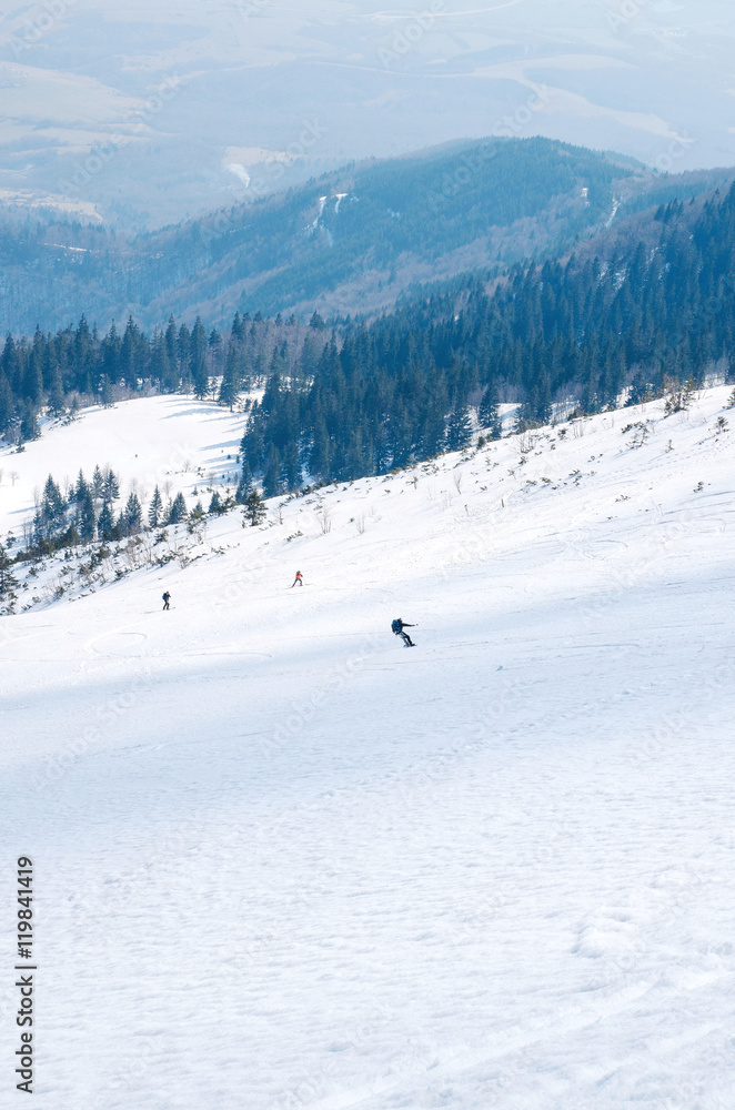 man ski free ride downhill at winter season in shadow on beautiful sunny day