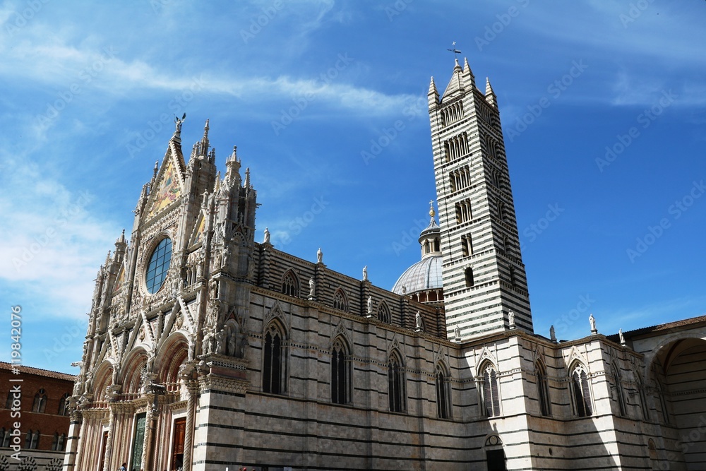 Sideview of Santa Maria Assunta Cathedral at Piazza del Duomo in Siena, Tuscany Italy