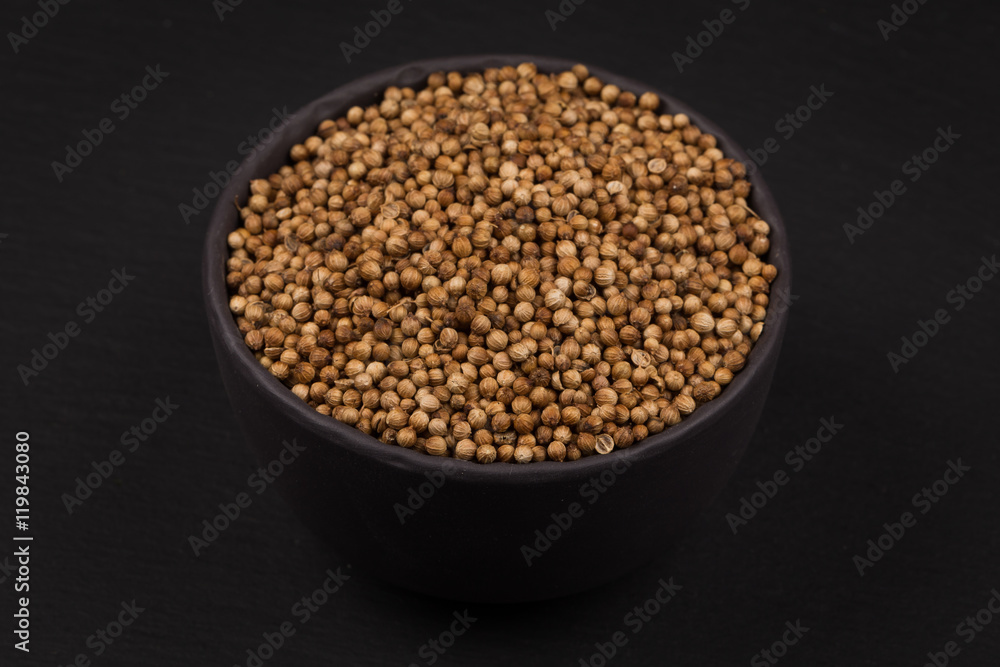Coriander seeds in small bowl Coriander seeds in small bowl