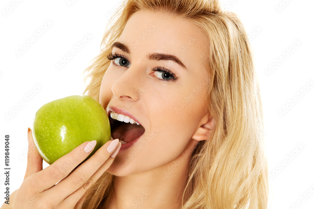 Young happy woman eating fresh green apple Young happy woman eating fresh green apple