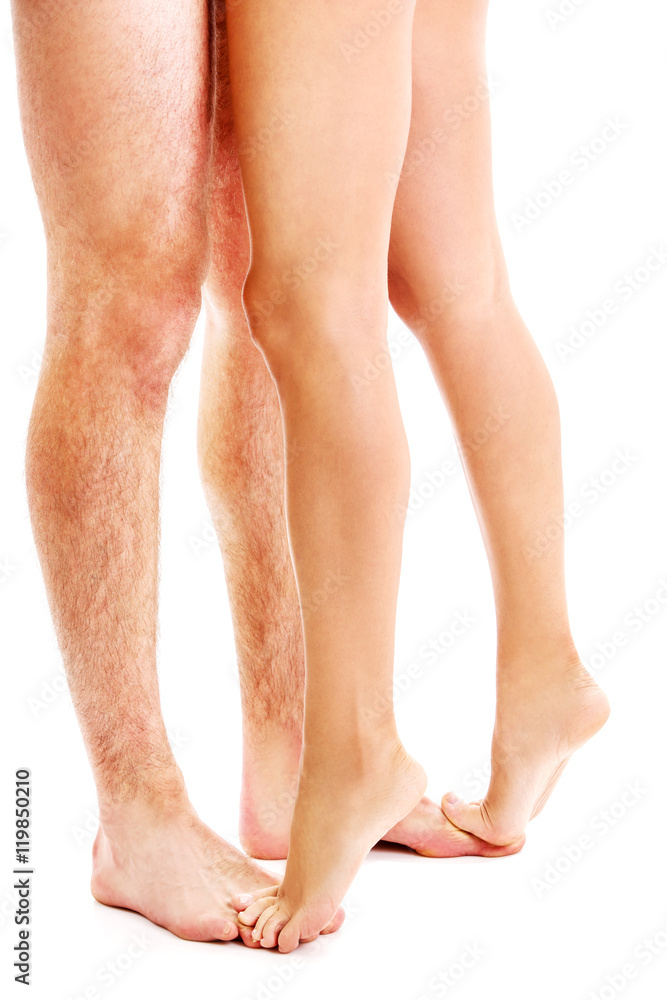woman and man legs with foot isolated on white woman and man legs with foot isolated on white