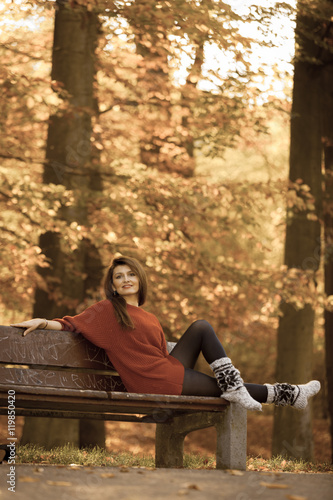 Woman relaxing on bench.
