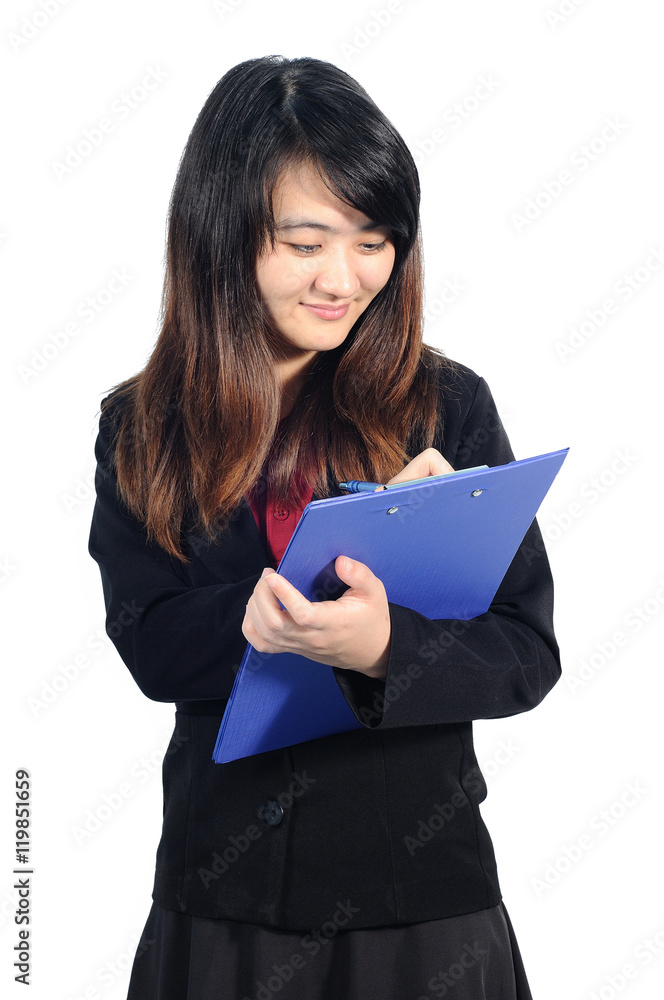 Asian middle business woman writing on blue folder, Thailand Asian middle business woman writing on blue folder, Thailand