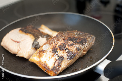 Searing fresh fish in a frying pan