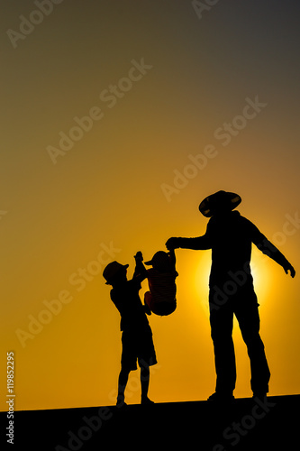 Summer sunset with happy family on outdoors background
