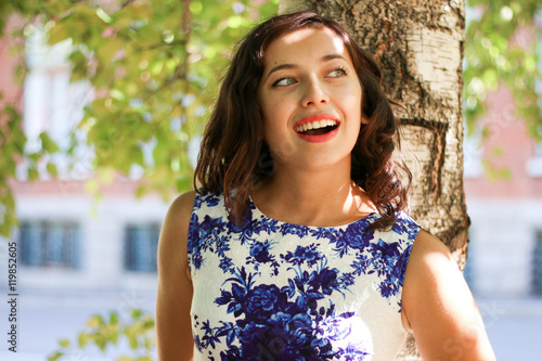 wonders girl posing by the tree