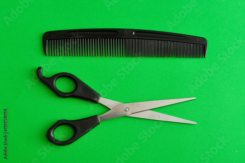 Hair cutting scissors and a comb