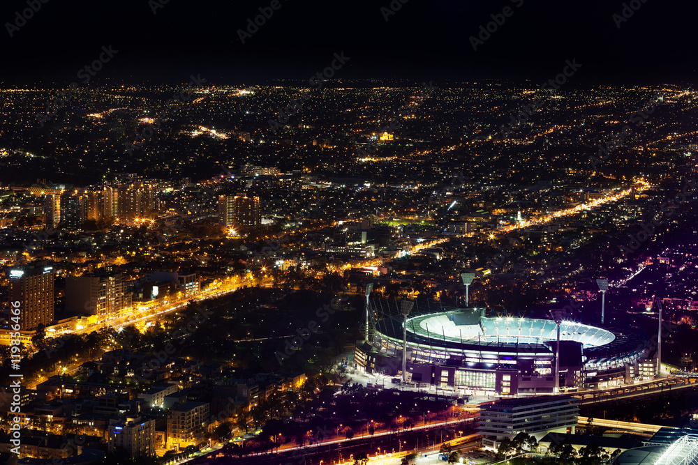 Melbourne, Australia - August 27, 2016: Aerial night view of the city and Melbourne Cricket Ground - home of Australian Football and the National Sprots Museum