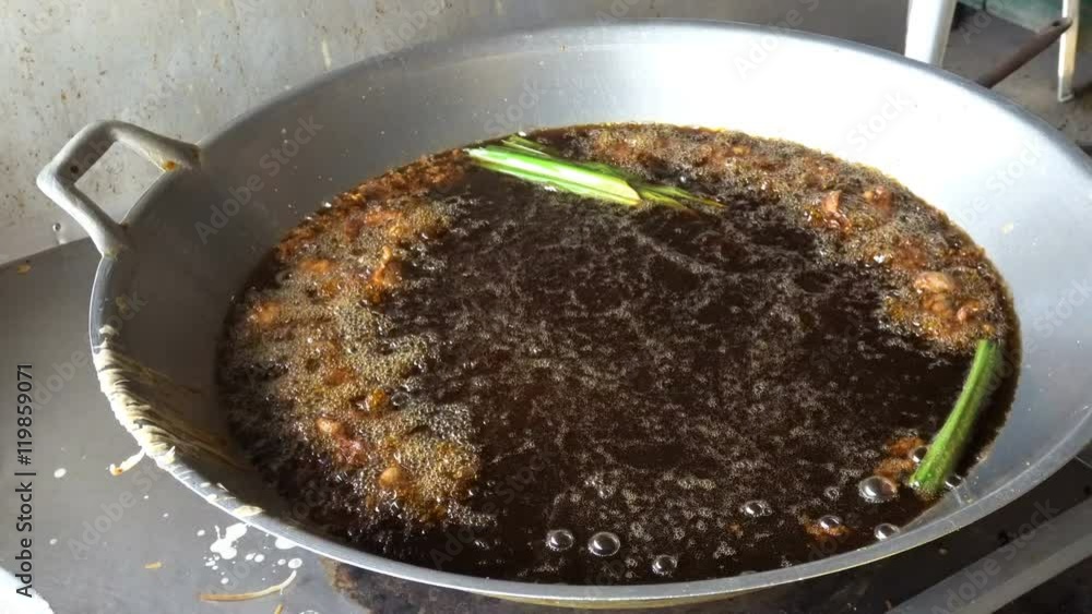 Boiling Fat Close up frying fat oil boiling in wok pan at Asian food market ...