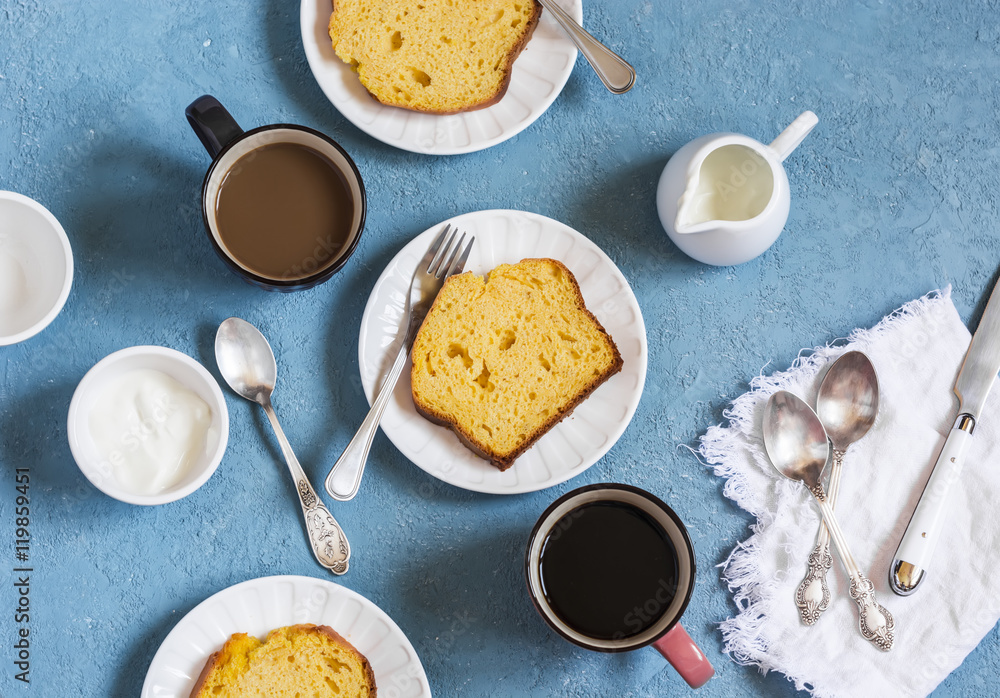 Pumpkin cake and coffee on a blue background. Delicious dessert, breakfast or snack Pumpkin cake and coffee on a blue background. Delicious dessert, breakfast or snack