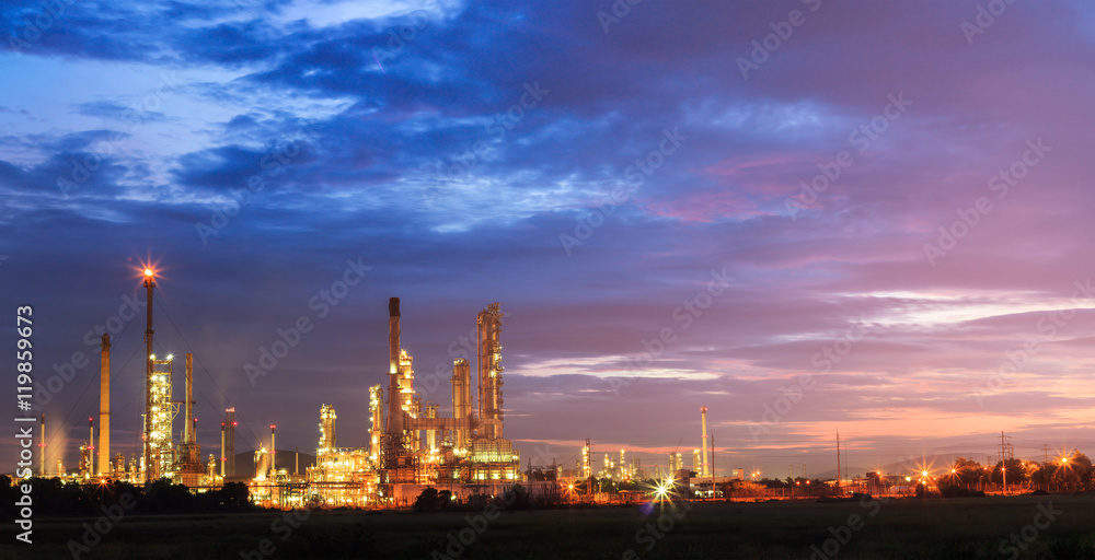 oil refinery, fuel manufacturer with beautiful sunrise or twilig