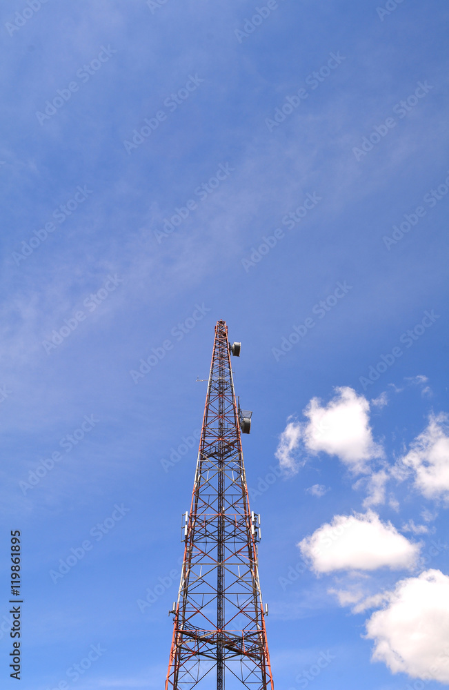 Communication antenna tower with blue sky background, Top of a cellular radio tower. Wireless technology for portable transceivers such as mobile, cell, smart phones, pagers, tablets. Mobile network.