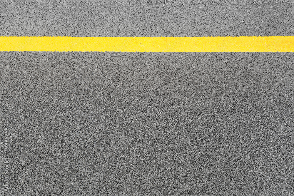 Black asphalt tarmac road or street and yellow line on top view