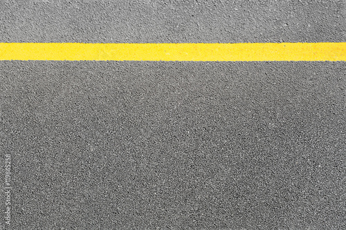 Black asphalt tarmac road or street and yellow line on top view