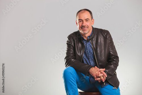 smiling mature man in leather jacket resting © Viorel Sima