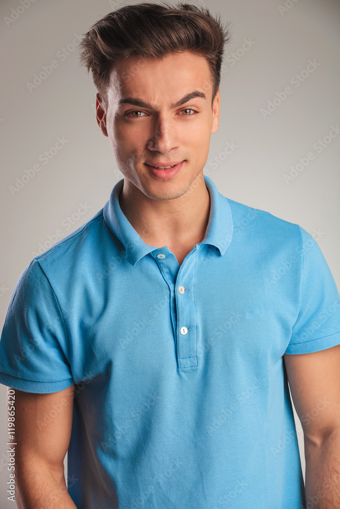 portrait of an angy young casual man in polo shirt portrait of an angy young casual man in polo shirt