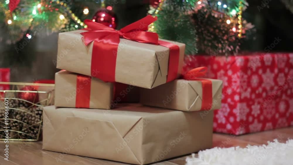 Christmas gifts are placed under the Christmas tree Christmas gifts are placed under the Christmas tree