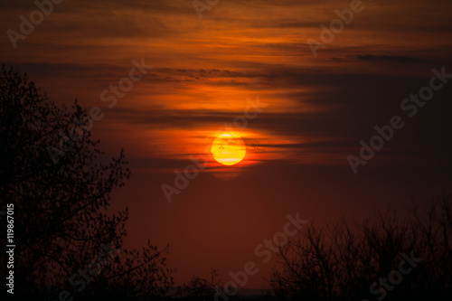 Beautiful sunset in the haze of clouds