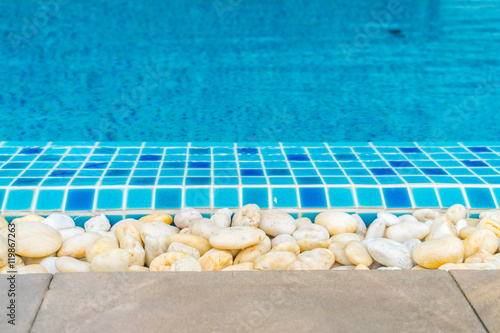 Blue swimming pool rippled water . photo