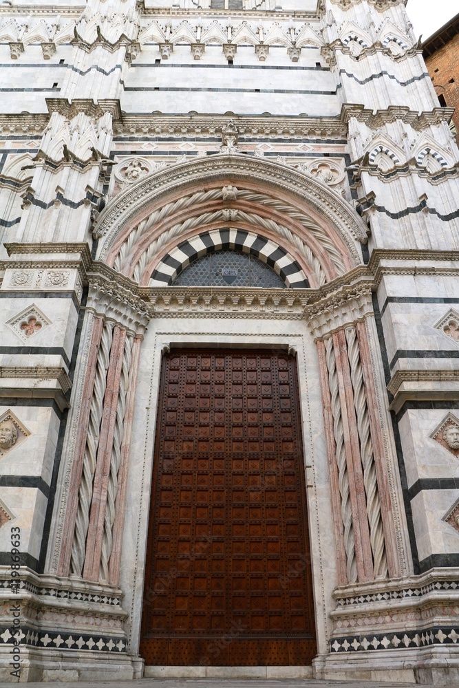 Door to Baptistery San Giovanni in Siena, Tuscany Italy