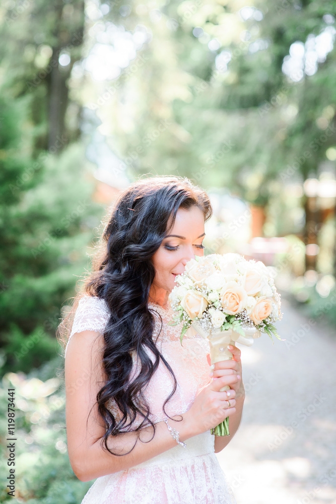 Beautiful luxury bride holding wedding bouquet Beautiful luxury bride holding wedding bouquet