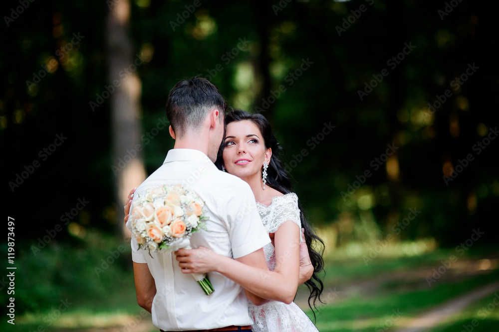 Beautiful luxury newlyweds posing outside Beautiful luxury newlyweds posing outside