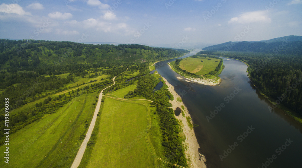 panorama of fields and river from the air