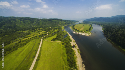 panorama of fields and river from the air