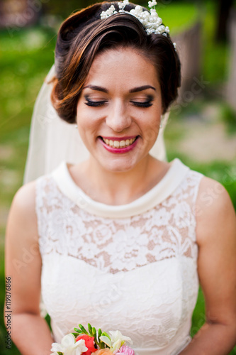 Fototapeta Naklejka Na Ścianę i Meble -  Amazing happy bride has closed her eyes